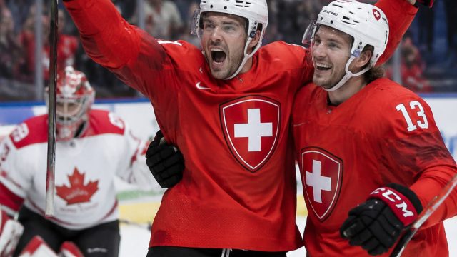 Switzerland Triumphs Over Canada to Secure Group B Victory |